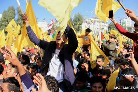 Palestinian Fatah supporters take part in a rally to mark the 13th anniversary of the death of late Palestinian leader Yasser Arafat in Gaza City on November 11, 2017. Photo by Mahmoud Ajour