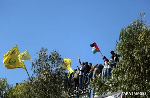 Palestinian Fatah supporters take part in a rally to mark the 13th anniversary of the death of late Palestinian leader Yasser Arafat in Gaza City on November 11, 2017. Photo by Mohammed Dahman