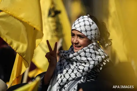 Palestinian Fatah supporters take part in a rally to mark the 13th anniversary of the death of late Palestinian leader Yasser Arafat in Gaza City on November 11, 2017. Photo by Mohammed Dahman