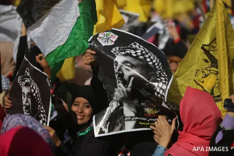 Palestinian Fatah supporters take part in a rally to mark the 13th anniversary of the death of late Palestinian leader Yasser Arafat in Gaza City on November 11, 2017. Photo by Mohammed Dahman