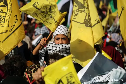Palestinian Fatah supporters take part in a rally to mark the 13th anniversary of the death of late Palestinian leader Yasser Arafat in Gaza City on November 11, 2017. Photo by Mohammed Dahman