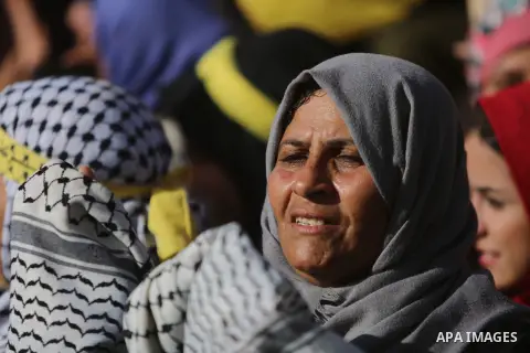 Palestinian Fatah supporters take part in a rally to mark the 13th anniversary of the death of late Palestinian leader Yasser Arafat in Gaza City on November 11, 2017. Photo by Mohammed Dahman