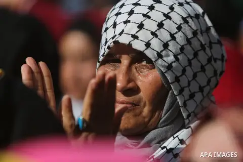 Palestinian Fatah supporters take part in a rally to mark the 13th anniversary of the death of late Palestinian leader Yasser Arafat in Gaza City on November 11, 2017. Photo by Mohammed Dahman