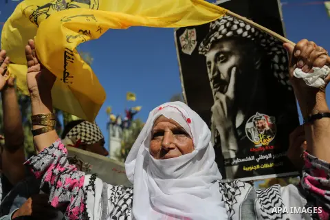 Palestinian Fatah supporters take part in a rally to mark the 13th anniversary of the death of late Palestinian leader Yasser Arafat in Gaza City on November 11, 2017. Photo by Mohammed Dahman