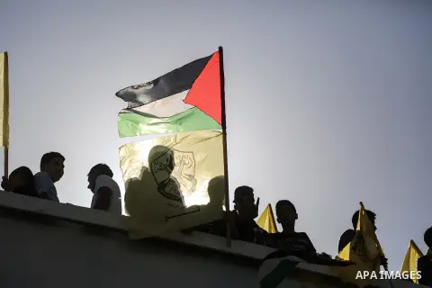 Palestinian Fatah supporters take part in a rally to mark the 13th anniversary of the death of late Palestinian leader Yasser Arafat in Gaza City on November 11, 2017. Photo by Mohammed Dahman