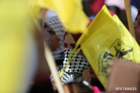 Palestinian Fatah supporters take part in a rally to mark the 13th anniversary of the death of late Palestinian leader Yasser Arafat in Gaza City on November 11, 2017. Photo by Mohammed Dahman