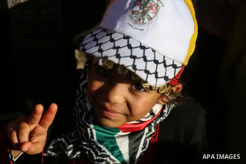 Palestinian Fatah supporters take part in a rally to mark the 13th anniversary of the death of late Palestinian leader Yasser Arafat in Gaza City on November 11, 2017. Photo by Mohammed Dahman
