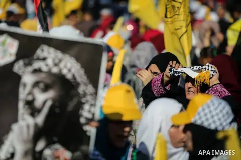 Palestinian Fatah supporters take part in a rally to mark the 13th anniversary of the death of late Palestinian leader Yasser Arafat in Gaza City on November 11, 2017. Photo by Mohammed Dahman