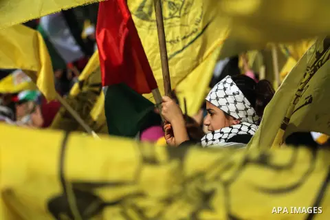 Palestinian Fatah supporters take part in a rally to mark the 13th anniversary of the death of late Palestinian leader Yasser Arafat in Gaza City on November 11, 2017. Photo by Mohammed Dahman