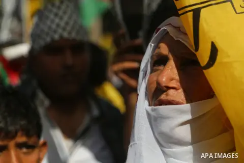 Palestinian Fatah supporters take part in a rally to mark the 13th anniversary of the death of late Palestinian leader Yasser Arafat in Gaza City on November 11, 2017. Photo by Mohammed Dahman