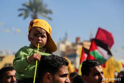 Palestinian Fatah supporters take part in a rally to mark the 13th anniversary of the death of late Palestinian leader Yasser Arafat in Gaza City on November 11, 2017. Photo by Mohammed Dahman