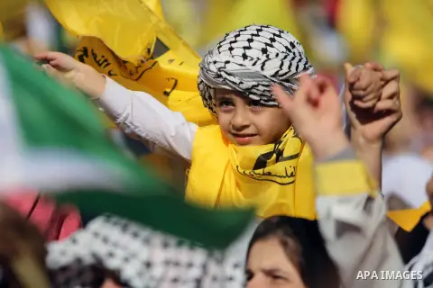 Palestinian Fatah supporters take part in a rally to mark the 13th anniversary of the death of late Palestinian leader Yasser Arafat in Gaza City on November 11, 2017. Photo by Mohammed Dahman
