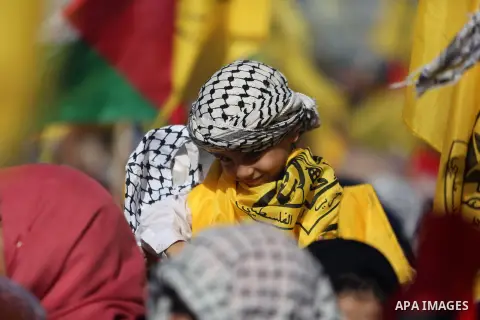 Palestinian Fatah supporters take part in a rally to mark the 13th anniversary of the death of late Palestinian leader Yasser Arafat in Gaza City on November 11, 2017. Photo by Mohammed Dahman