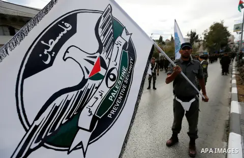 Palestinian security forces take part a parade marking the 29th anniversary of Palestinian Declaration of Independence, in the West Bank city of Hebron on November 14, 2017. Photo by Wisam Hashlamoun