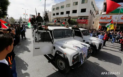 Palestinian security forces take part a parade marking the 29th anniversary of Palestinian Declaration of Independence, in the West Bank city of Hebron on November 14, 2017. Photo by Wisam Hashlamoun