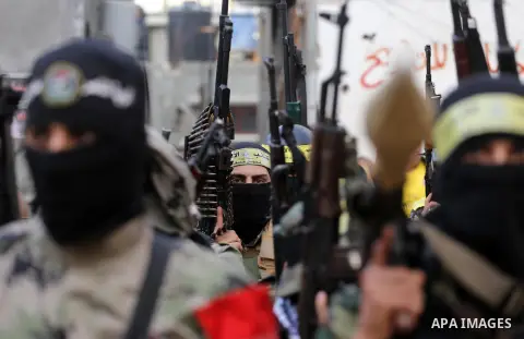 Palestinian militants from various local factions take part in a military parade to mark the fifth anniversary of Ahmed al-Jabari death, the late leader of Ezzedine al-Qassam Brigades, the armed wing of the Palestinian H...