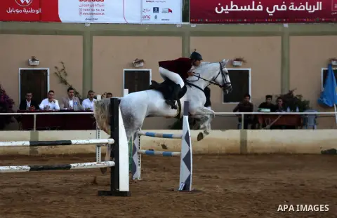 A Palestinian competitor rides a horse during the equestrian championship in Gaza City, Gaza on November 17, 2017. Photo by Mohammed Asad