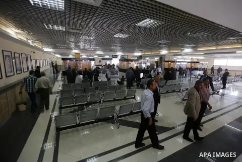 Palestinians wait in a hall at the Rafah border crossing with Egypt, under the control of the Palestinian Authority, before being allowed to pass out of the southern Gaza Strip on November 18, 2017, after it opened for t...