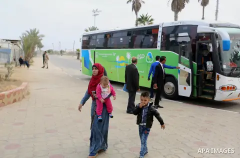 Palestinians wait at the Rafah border crossing with Egypt, under the control of the Palestinian Authority, before being allowed to pass out of the southern Gaza Strip on November 18, 2017, after it opened for three days...