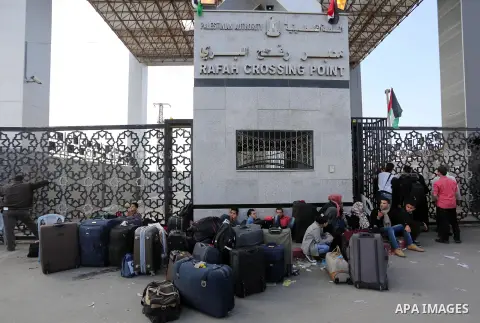 Palestinians wait to cross at the Rafah border crossing with Egypt before being allowed to pass out of the southern Gaza Strip on November 20, 2017, following its opening for three days for the first time since a Palesti...