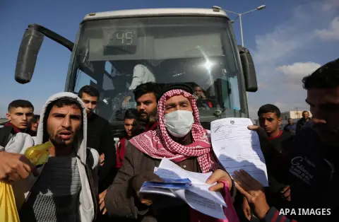 A Palestinian man gestures outside Rafah border crossing demanding to travel for treatment in the southern Gaza Strip on November 20, 2017, following its opening for three days for the first time since a Palestinian reco...