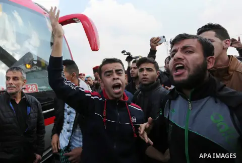 Palestinian students shout outside Rafah border crossing demanding to travel to complete their study abroad in the southern Gaza Strip on November 20, 2017, following its opening for three days for the first time since a...