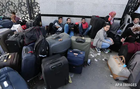Palestinians wait to cross at the Rafah border crossing with Egypt before being allowed to pass out of the southern Gaza Strip on November 20, 2017, following its opening for three days for the first time since a Palesti...