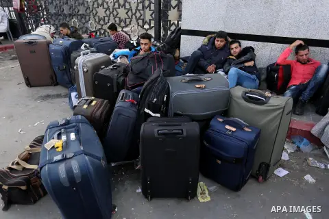 Palestinians wait to cross at the Rafah border crossing with Egypt before being allowed to pass out of the southern Gaza Strip on November 20, 2017, following its opening for three days for the first time since a Palesti...