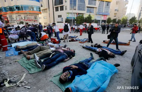 Members of Palestinian security forces and Civil Defense take part in a security drill in the West Bank city of Hebron on November 20, 2017. Photo by Wisam Hashlamoun