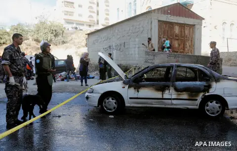 Members of Palestinian security forces and Civil Defense take part in a security drill in the West Bank city of Hebron on November 20, 2017. Photo by Wisam Hashlamoun