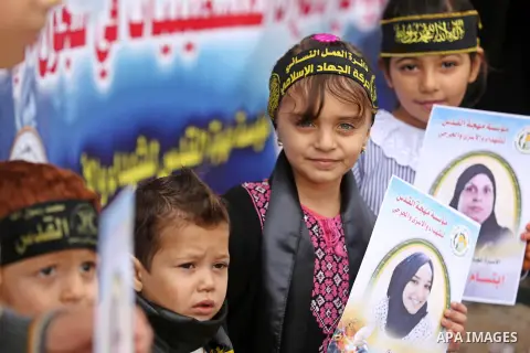 Palestinian women take part in a protest to show solidarity with Palestinian women prisoners held in Israeli jails on the occasion of the international Day for the Elimination of Violence Against Women, in Gaza city on N...