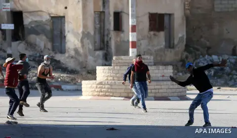 Palestinian protesters clash with Israeli security forces in the northern village of Qusra in the occupied West Bank near Nablus on December 1, 2017. Yesterday a Palestinian farmer Mahmoud Odeh, 48, was shot dead by an I...