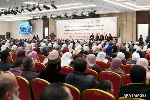 Palestinian President Mahmoud Abbas attends a ceremony to commemorate the birth of the Prophet Mohamed in the West Bank city of Ramallah on December 2, 2017. Photo by Osama Falah