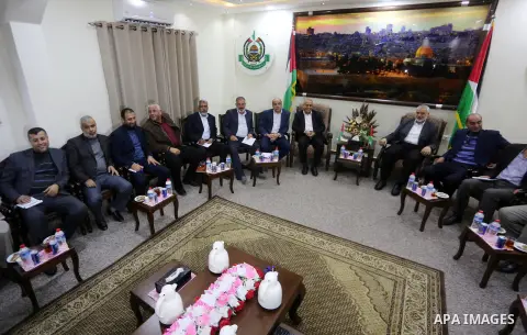 Hamas Chief Ismail Haniyeh meets with members of Palestinian factions after they returning to the Gaza Strip from Cairo, in Gaza city on December 5, 2017. Photo by Mohammed Asad