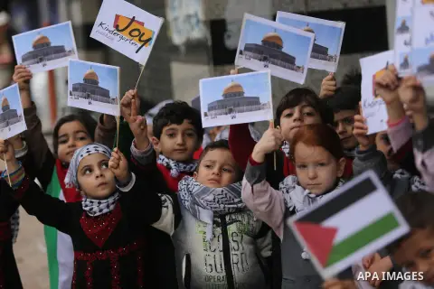 Palestinian children hold Palestine flags and pictures of Jerusalem during a protest in Gaza city, on December 6, 2017. U.S. officials say President Donald Trump will recognize Jerusalem as Israel's capital Wednesday, De...
