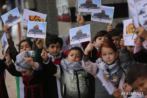 Palestinian children hold Palestine flags and pictures of Jerusalem during a protest in Gaza city, on December 6, 2017. U.S. officials say President Donald Trump will recognize Jerusalem as Israel's capital Wednesday, De...