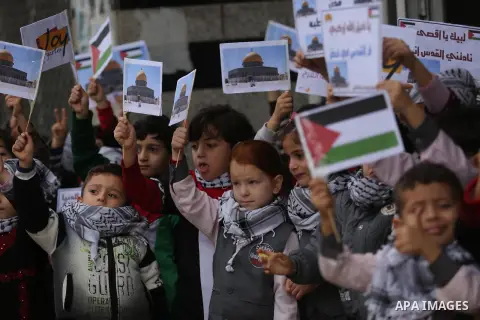Palestinian children hold Palestine flags and pictures of Jerusalem during a protest in Gaza city, on December 6, 2017. U.S. officials say President Donald Trump will recognize Jerusalem as Israel's capital Wednesday, De...