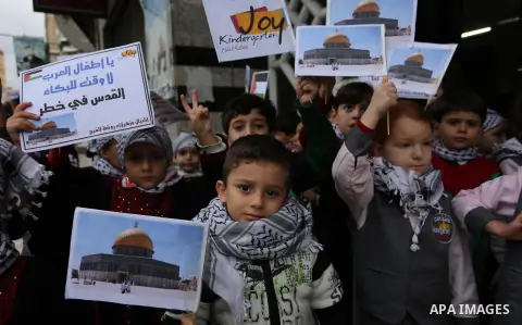 Palestinian children hold Palestine flags and pictures of Jerusalem during a protest in Gaza city, on December 6, 2017. U.S. officials say President Donald Trump will recognize Jerusalem as Israel's capital Wednesday, De...