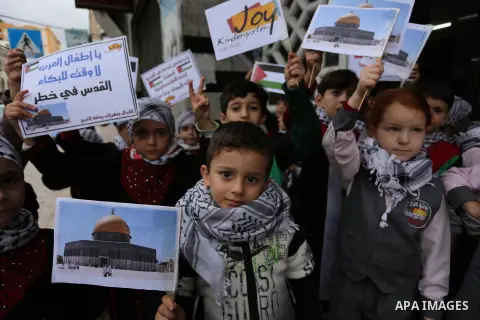 Palestinian children hold Palestine flags and pictures of Jerusalem during a protest in Gaza city, on December 6, 2017. U.S. officials say President Donald Trump will recognize Jerusalem as Israel's capital Wednesday, De...