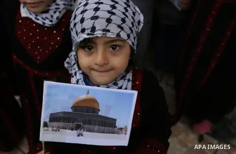Palestinian children hold Palestine flags and pictures of Jerusalem during a protest in Gaza city, on December 6, 2017. U.S. officials say President Donald Trump will recognize Jerusalem as Israel's capital Wednesday, De...