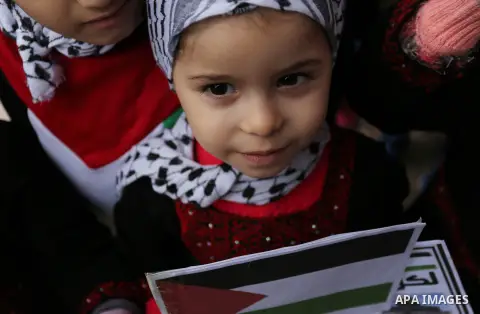 Palestinian children hold Palestine flags and pictures of Jerusalem during a protest in Gaza city, on December 6, 2017. U.S. officials say President Donald Trump will recognize Jerusalem as Israel's capital Wednesday, De...