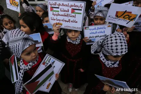 Palestinian children hold Palestine flags and pictures of Jerusalem during a protest in Gaza city, on December 6, 2017. U.S. officials say President Donald Trump will recognize Jerusalem as Israel's capital Wednesday, De...