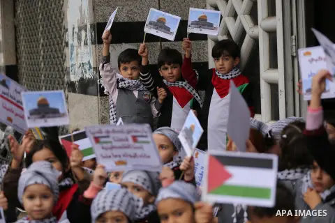 Palestinian children hold Palestine flags and pictures of Jerusalem during a protest in Gaza city, on December 6, 2017. U.S. officials say President Donald Trump will recognize Jerusalem as Israel's capital Wednesday, De...