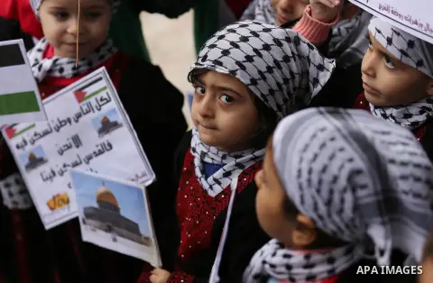 Palestinian children hold Palestine flags and pictures of Jerusalem during a protest in Gaza city, on December 6, 2017. U.S. officials say President Donald Trump will recognize Jerusalem as Israel's capital Wednesday, De...