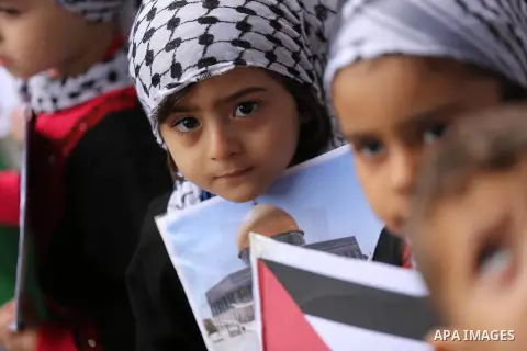 Palestinian children hold Palestine flags and pictures of Jerusalem during a protest in Gaza city, on December 6, 2017. U.S. officials say President Donald Trump will recognize Jerusalem as Israel's capital Wednesday, De...