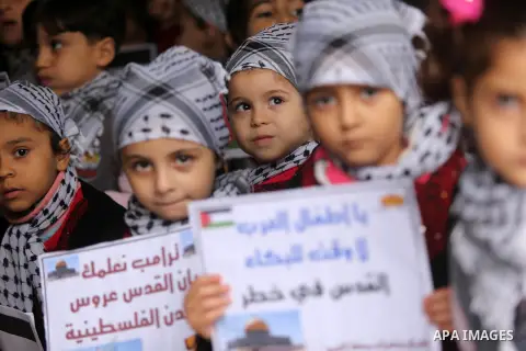 Palestinian children hold Palestine flags and pictures of Jerusalem during a protest in Gaza city, on December 6, 2017. U.S. officials say President Donald Trump will recognize Jerusalem as Israel's capital Wednesday, De...