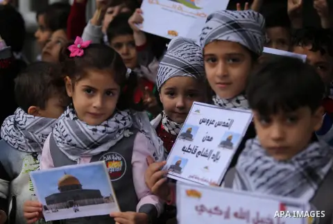Palestinian children hold Palestine flags and pictures of Jerusalem during a protest in Gaza city, on December 6, 2017. U.S. officials say President Donald Trump will recognize Jerusalem as Israel's capital Wednesday, De...