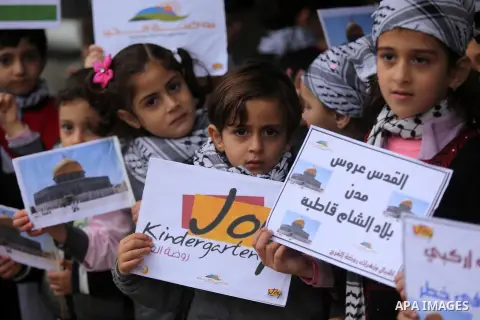 Palestinian children hold Palestine flags and pictures of Jerusalem during a protest in Gaza city, on December 6, 2017. U.S. officials say President Donald Trump will recognize Jerusalem as Israel's capital Wednesday, De...