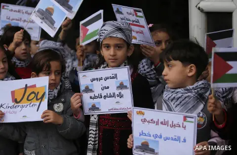 Palestinian children hold Palestine flags and pictures of Jerusalem during a protest in Gaza city, on December 6, 2017. U.S. officials say President Donald Trump will recognize Jerusalem as Israel's capital Wednesday, De...