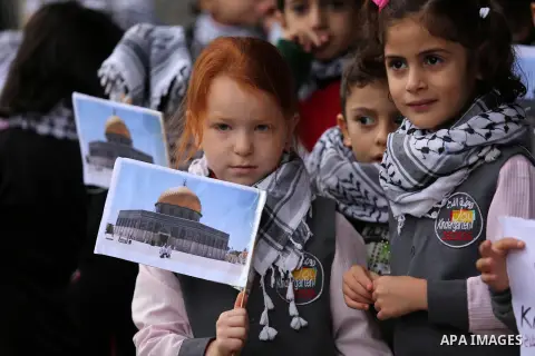 Palestinian children hold Palestine flags and pictures of Jerusalem during a protest in Gaza city, on December 6, 2017. U.S. officials say President Donald Trump will recognize Jerusalem as Israel's capital Wednesday, De...